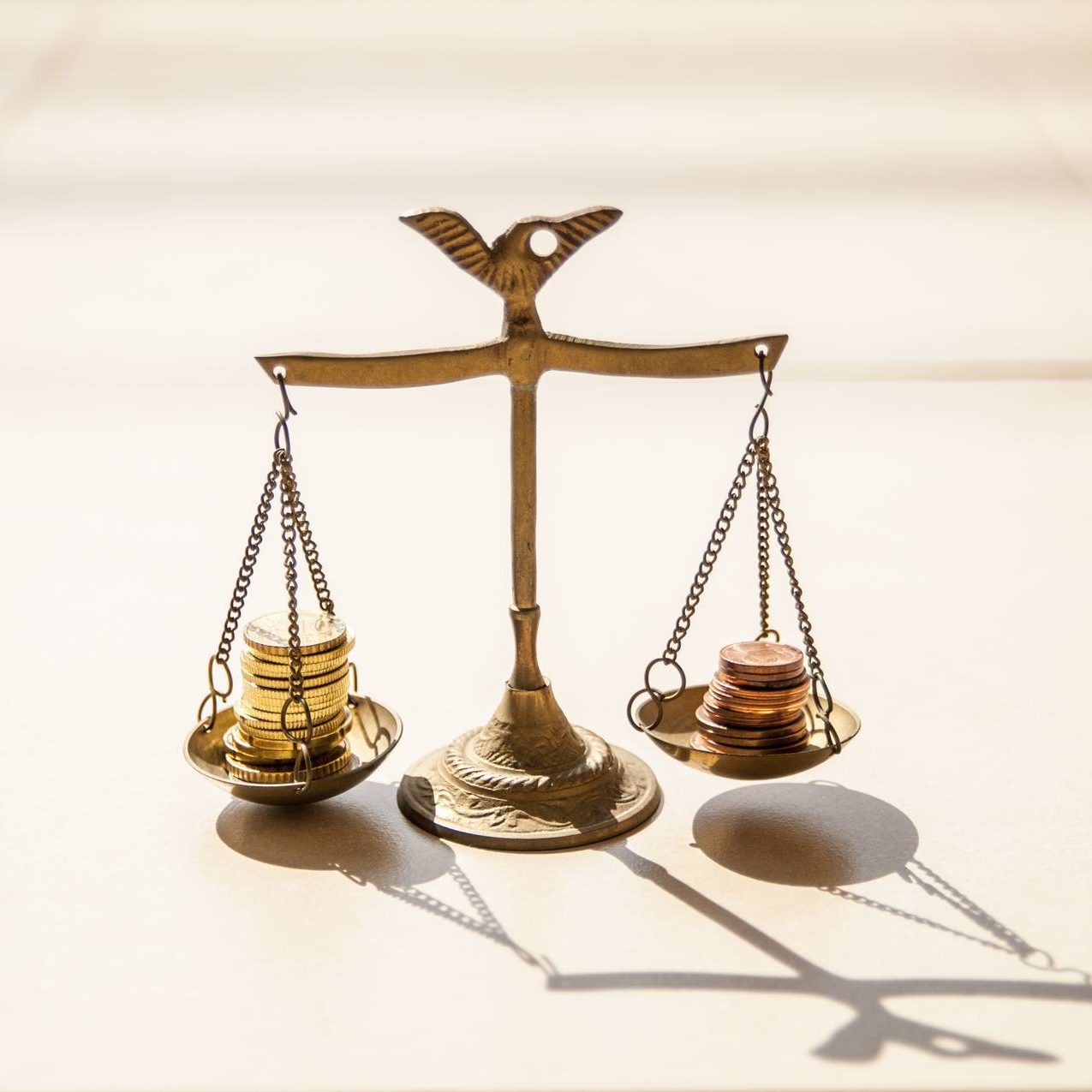 Coins on scales Coins on brass scales
